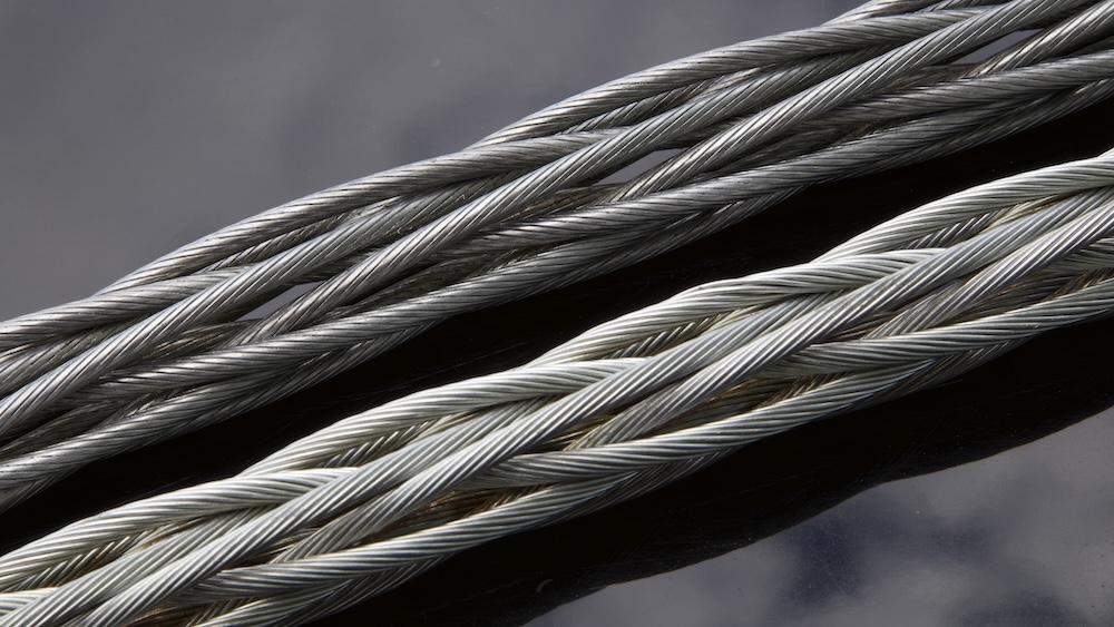 ropes_HD+superior a tall metal tower with lots of wires on top of it